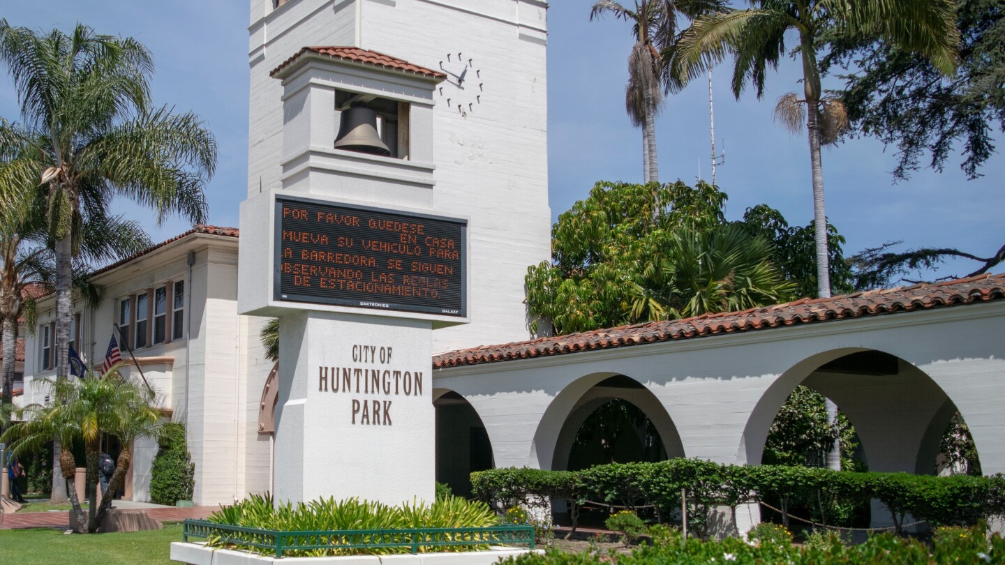 The City of Huntington Park sign in front of City Hall hosts a welcome message for residents passing by.