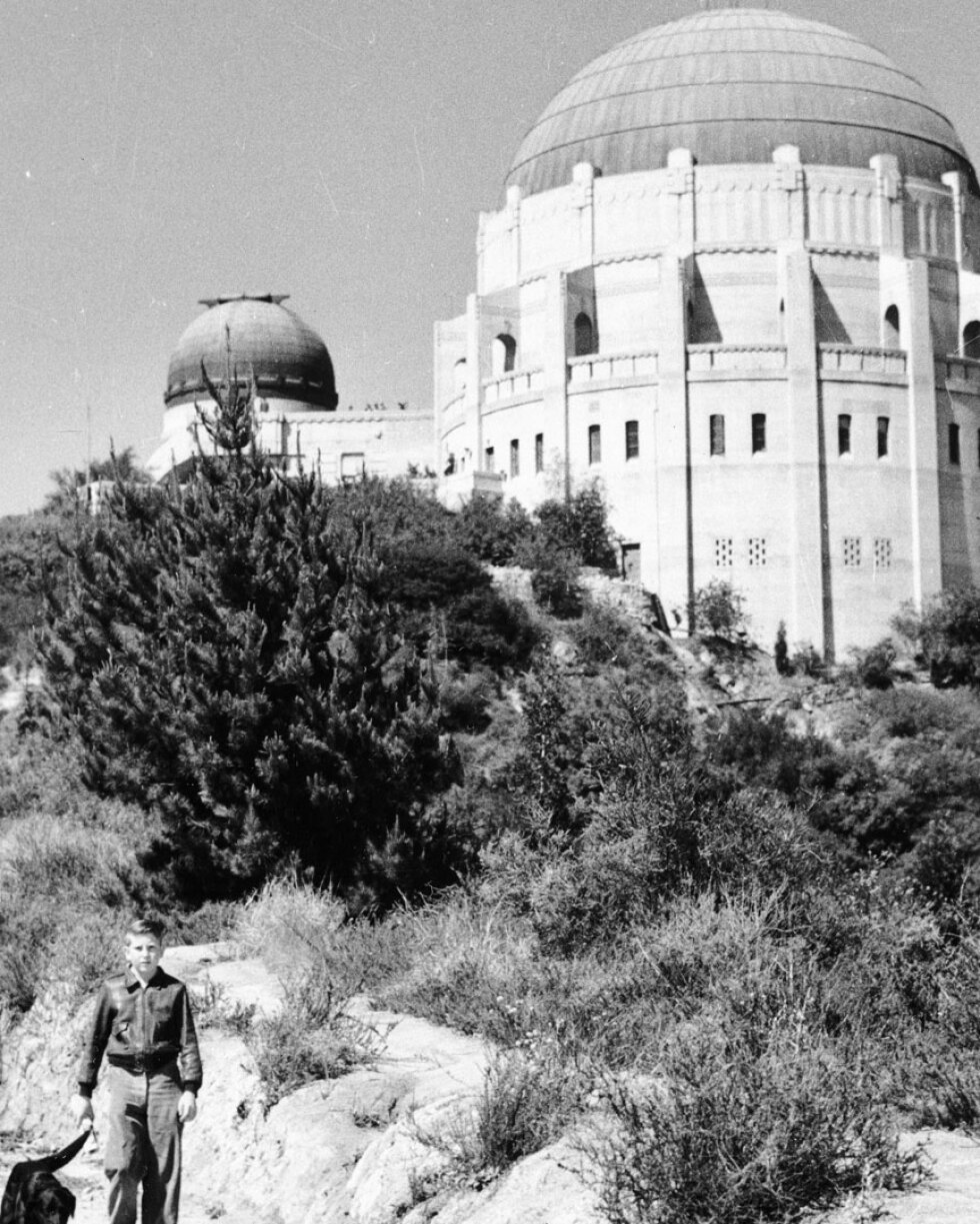 Young men walking with a view of Griffith Observatory | Courtesy of the California Historical Society Collection at the University of Southern California Library