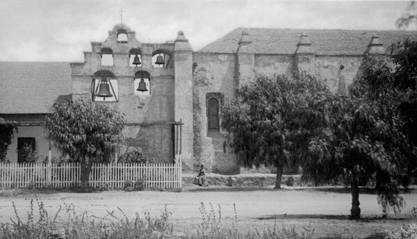 Pepper trees shade the ground outside Mission San Gabriel, ca.1884. Courtesy of the USC Libraries - California Historical Society Collection.
