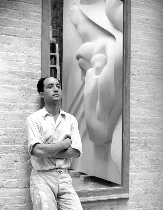 Isamu Noguchi working on the Associated Press Building Plaque, which was carved in plaster and cast in stainless steel - at that time the largest-ever stainless steel casting, New York, New York, 1940. It is still installed in Rockefeller Center.