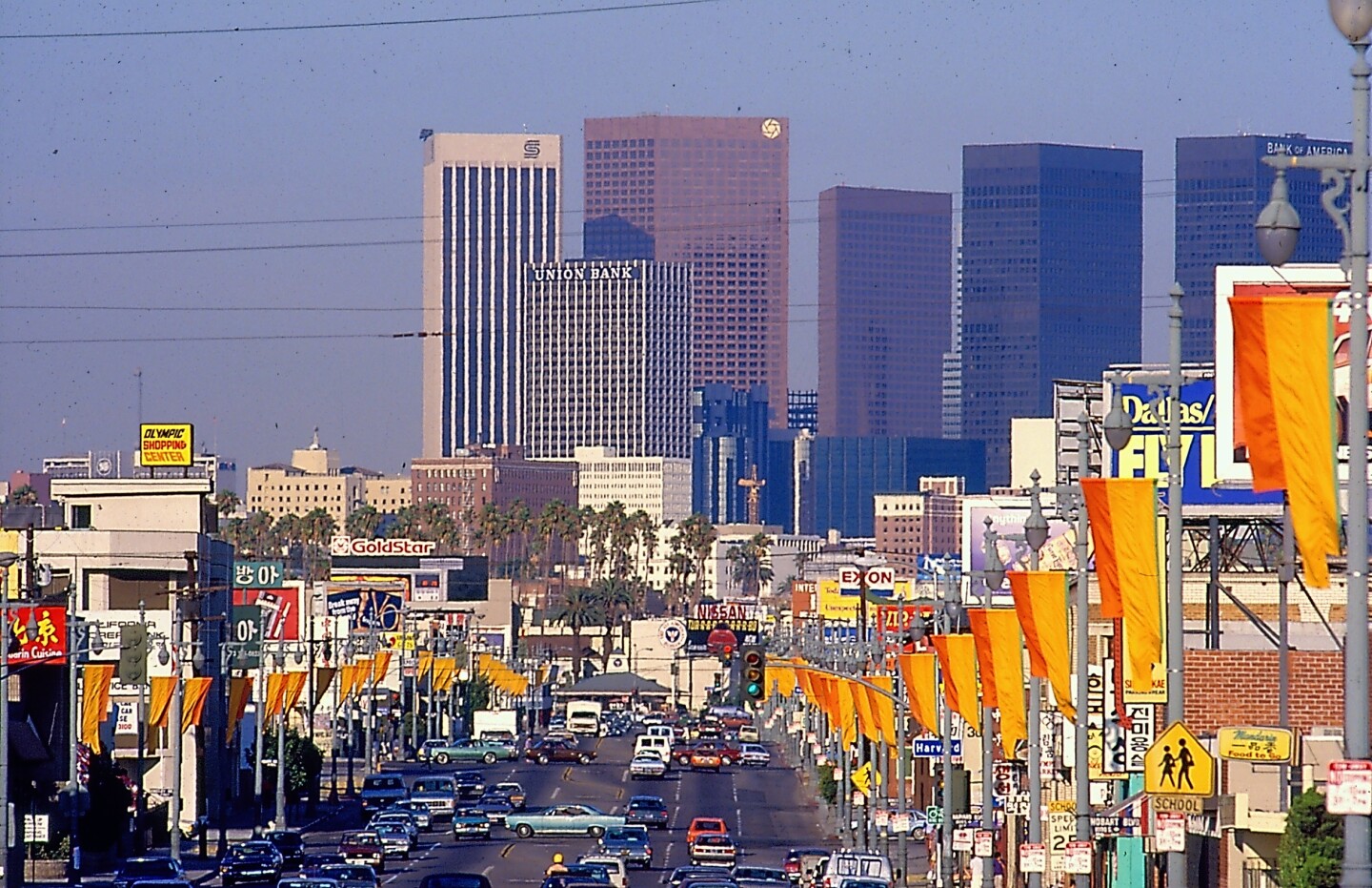 Orange and yellow street banners deck out the city streets during the 1984 Los Angeles Olympics.