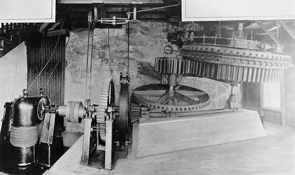 Shown here is a grip wheel, 9 feet in diameter, and other parts of the machinery called winding machinery located at the Echo Mountain station. | Courtesy of the Los Angeles Public Library