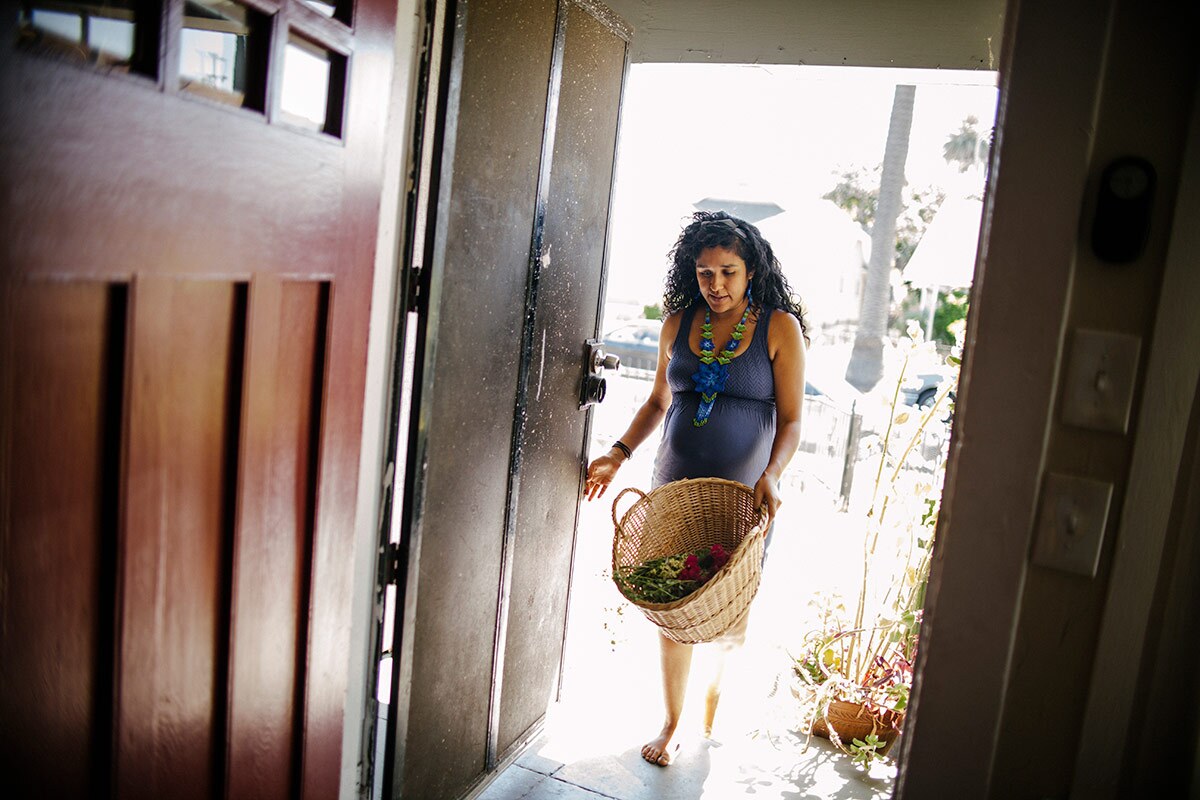 Panquetzani walks in through a door. | Samanta Helou Hernandez