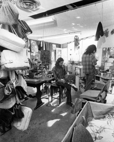Stanley Williams (sitting) was the shop manager for the Gay Community Services Center Gaywill Funky Shoppe, circa 1972. | ONE National Gay and Lesbian Archives, USC Libraries