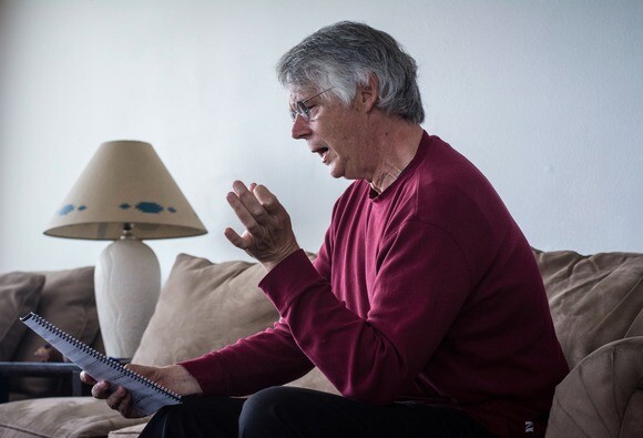 Mark Abel sings along with one of his compositions. | Chris Daly