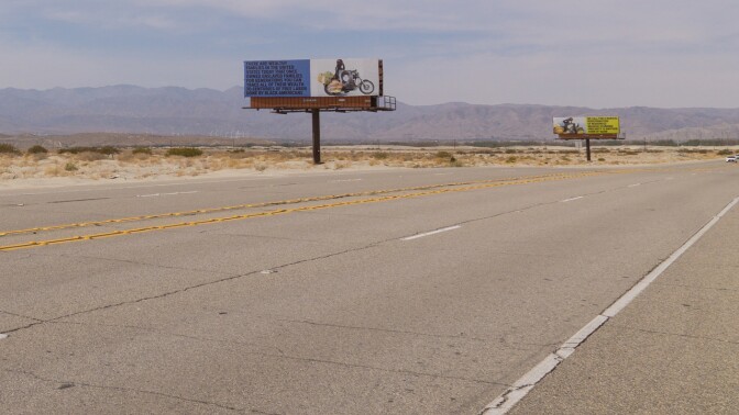 Xaviera Simmons' "Because You Know Ultimately We Will Band A Militia" is a series of billboards along Gene Autry Trail as part of Desert X 2021.