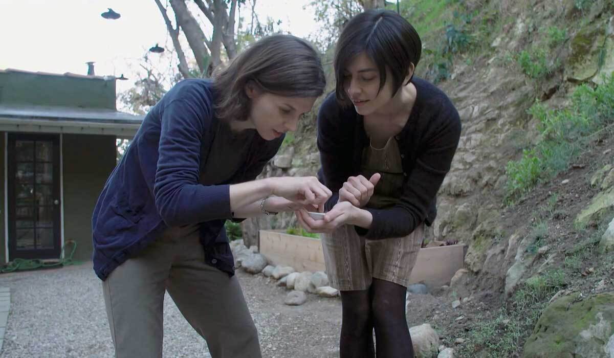 Jann Vendetti, curator of malacology at the Natural History Museum, with citizen scientist Emily Han. | Still from "Earth Focus" episode on urban habitats.