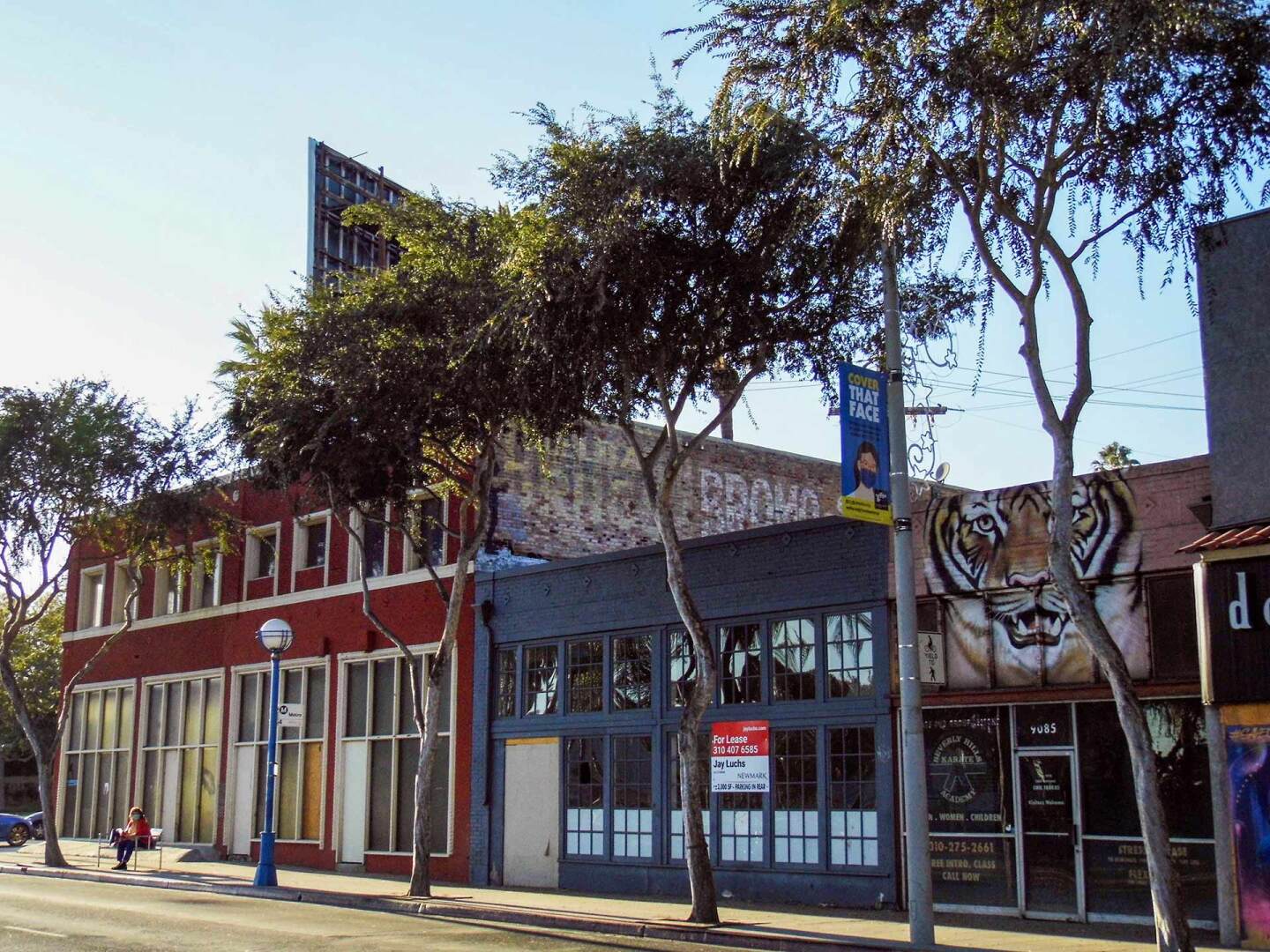 A ghost sign reads “Melba Drugs” and “BROMO SELTZER” on the east-facing side of the Fruechtl building in West Hollywood.