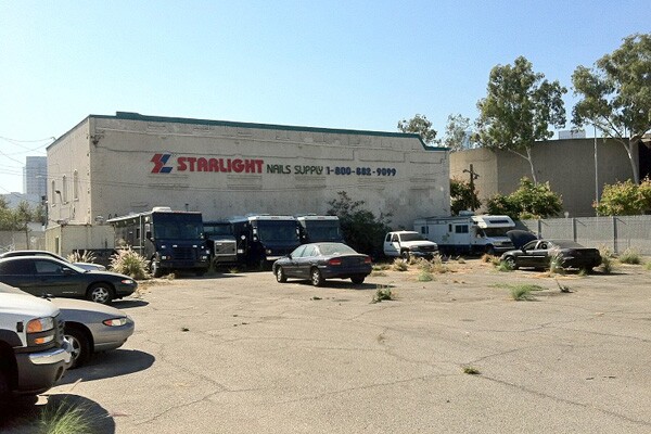 Parking lot with city vehicles in disrepair