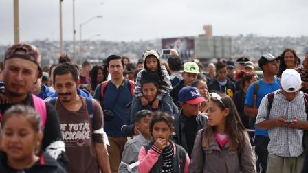 U.S. allows in trickle of asylum seekers from caravan