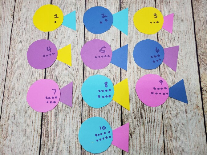 Colorful cutouts in the shape of fish are labelled one through 10.