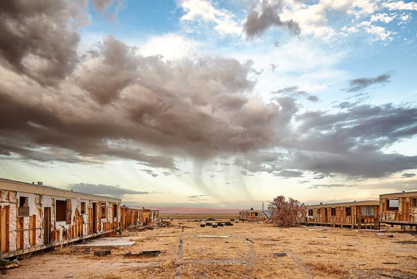 Warm-toned desert buildings during a light sunset.