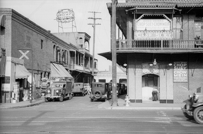 Old Chinatown picture with signs saying "chop together" And the "chow mein"