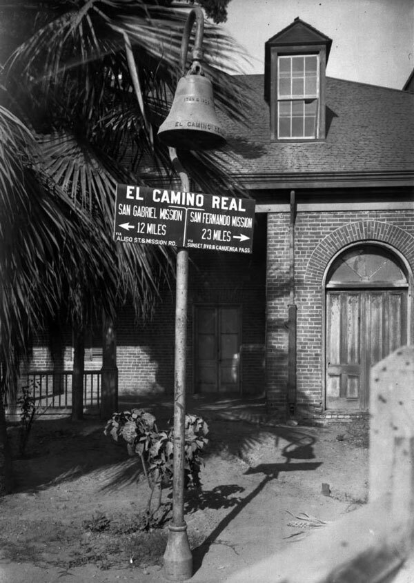The first El Camino Real bell was erected on August 14, 1906 outside the Plaza Church in Los Angeles. Courtesy of the Title Insurance and Trust, and C.C. Pierce Photography Collection, USC Libraries.