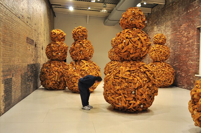 Nari Ward often incorporates found objects into his sculpture such as shoelaces or mango seeds, like in Mango Tourists, a series of 10-foot sculptures at the Massachusetts Museum of Contemporary Art. | Flickr/Len Radin/Creative Commons (CC BY-NC-SA 2.0)