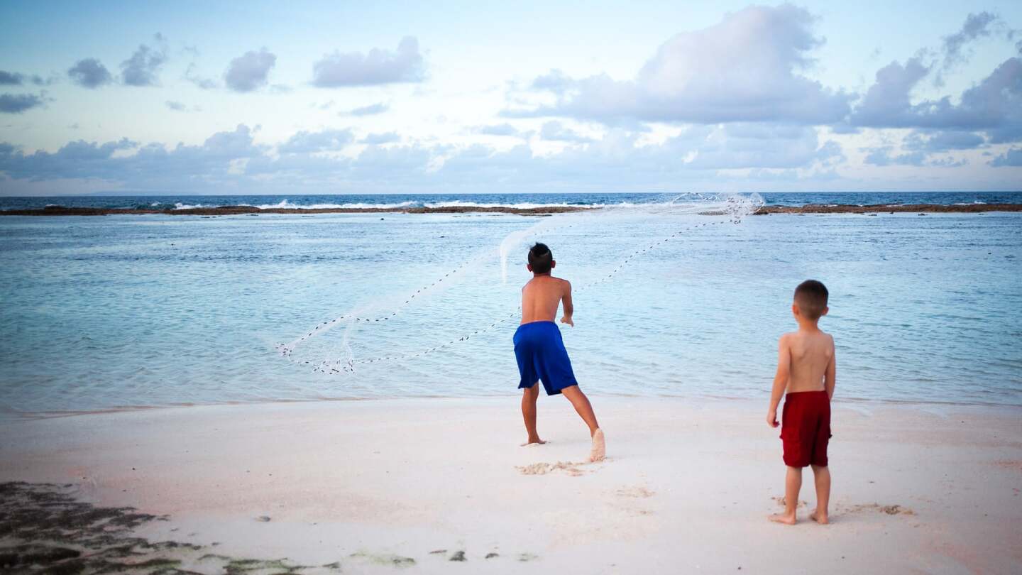 Boys playing by the beach in Guam | Kyle Hausmann-Stokes