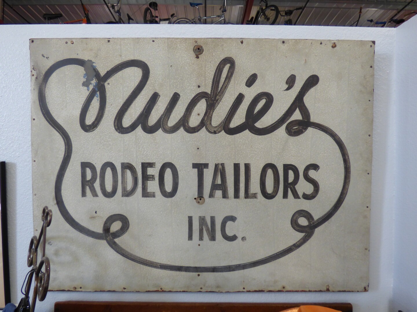 The storefront sign for Nudie's | Henry Cram