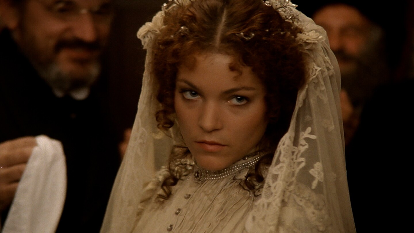 A woman stares intently at something.