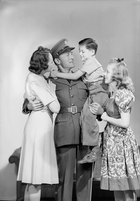 Models posing as family members and a soldier.