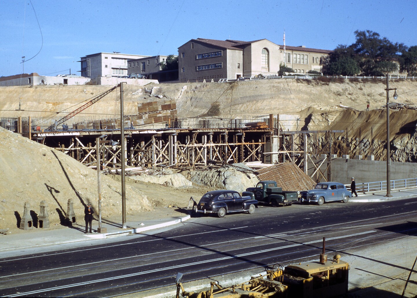 Construction of the Hollywood and Harbor freeways required crews to cut artificial canyons through Fort Moore and Bunker Hills. Courtesy of the Herald-Examiner Collection - Los Angeles Public Library.