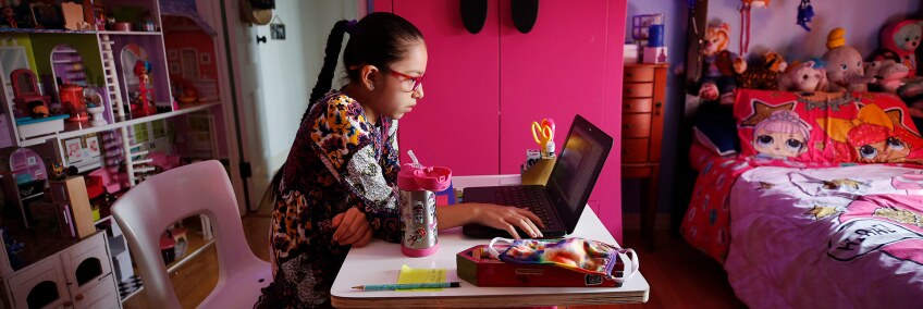 9-year-old Priscilla Guerrero uses a laptop computer for her 4th grade Los Angeles Unified School District online class in her room during remote learning lessons at home on Sept. 17, 2020. Boyle Heights in Los Angeles. | Al Seib / Los Angeles Times