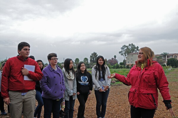 Marianne welcomes the students to Earthworks Farm