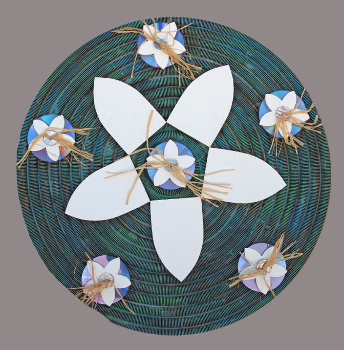 Artist Gerald Clarke Jr. crafted "Basket Exploration: Pivat" from wood, resin, raffia and DVD disks.