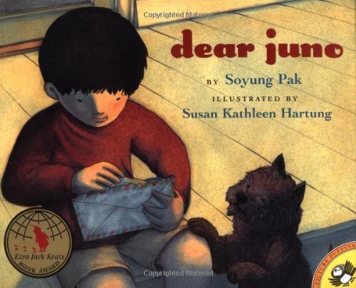 Book cover of "Dear Juno" written by Soyung Pak and illustrated by Susan Kathleen Hartung featuring an illustration of a boy with a letter and a dog next to him.