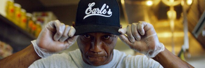 Duane Earl shows his Earl's cap. | Still from "Broken Bread"