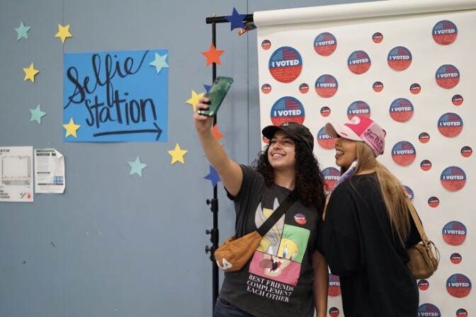 Ayah Alayanini and Jenny Zelaya take a post-voting selfie at the Santa Monica College vote center on Election Day, Tuesday, Nov. 3, 2020. | Al Kamalizad/LAist