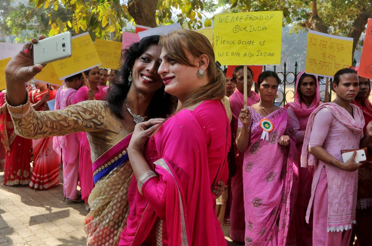 People belonging to the transgender community take a picture wearing saris with a mobile phone before the start of a rally for transgender rights in Mumbai, India, January 13, 2017. | REUTERS/Shailesh Andrade