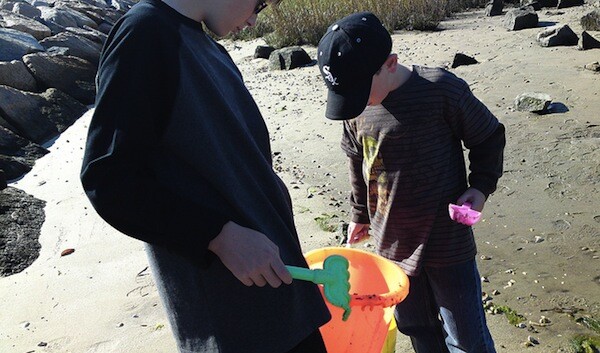 On the beach, searching for crabs.