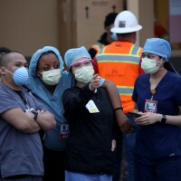 Nurses stand outside of Kaiser Hospital