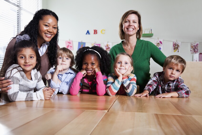 Preschool children with teachers in classroom