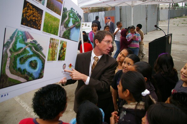 Gary Lee Moore shows area children the full vision of the wetlands at the groundbreaking in 2010 | Photo by Ed Fuentes