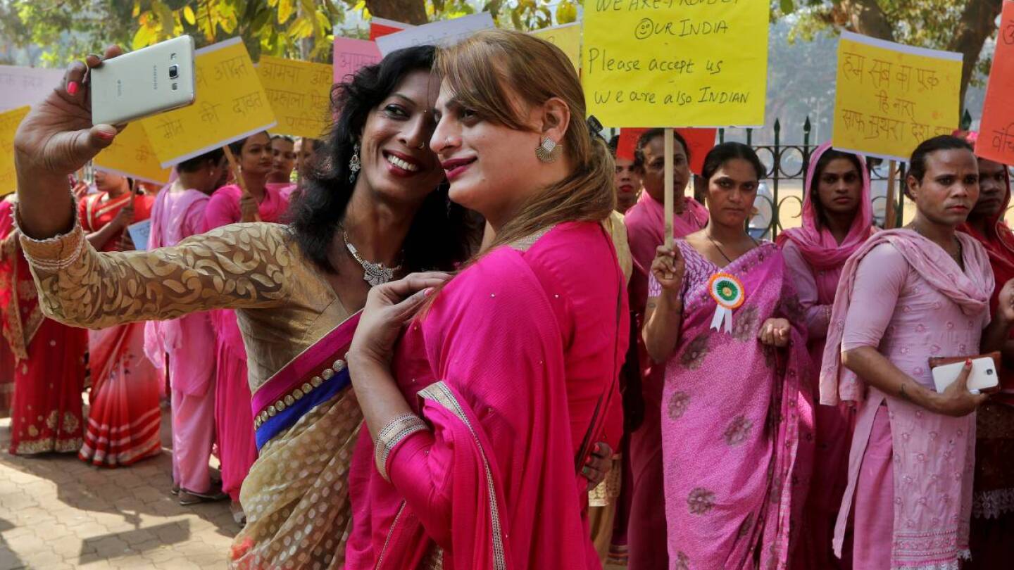 People belonging to the transgender community take a picture wearing saris with a mobile phone before the start of a rally for transgender rights in Mumbai, India, January 13, 2017. | REUTERS/Shailesh Andrade