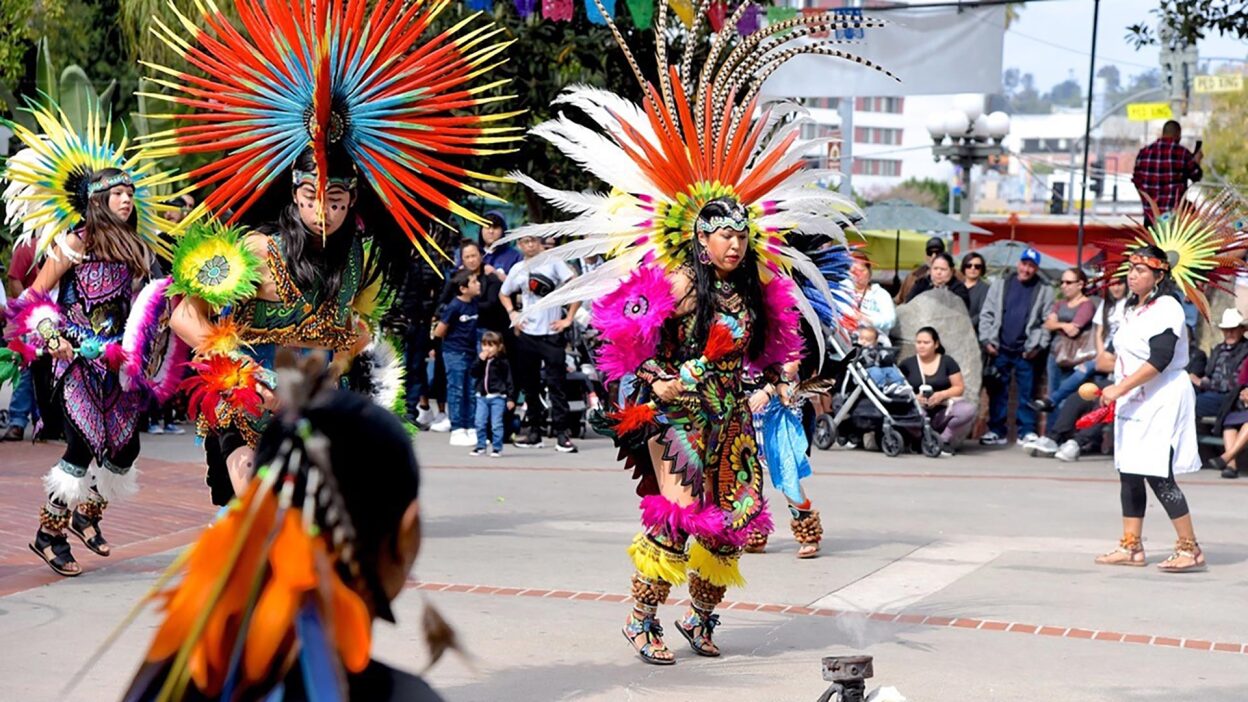 From left to right: Mayahuel and Ocelotl dance with their mother, Lupe Tellez. | Courtesy of Lupe Tellez