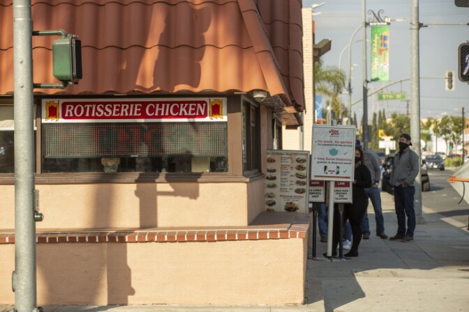 Customers wait in line at King Taco in Maywood. | Chava Sanchez/LAist