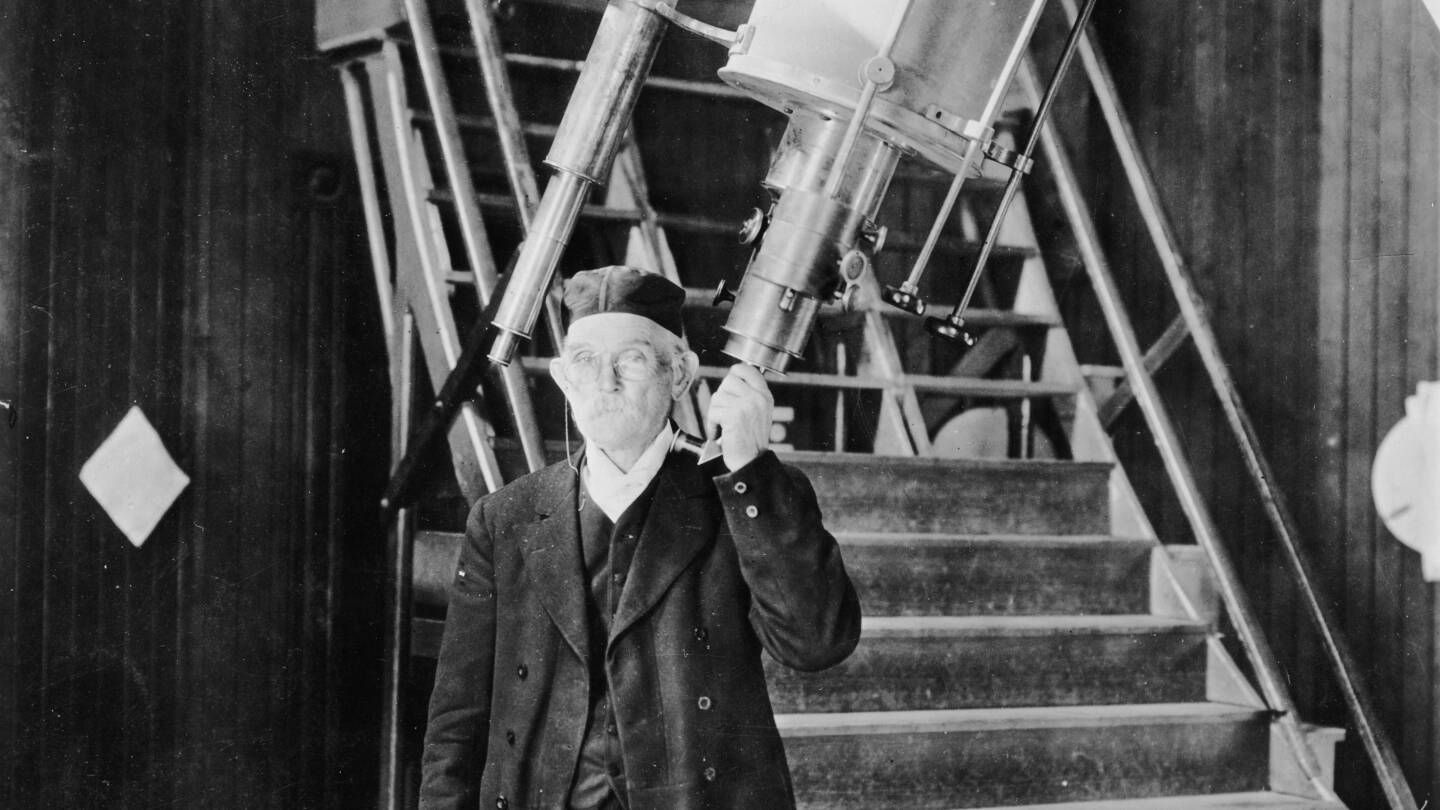 An archival black-and-white photo of Edgar Lucien Larkin inside the Lowe Observatory on Echo Mountain.