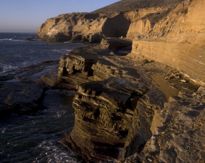 View of sandstone cliffs above the ocean