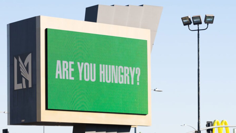 Barbara Kruger asks "Are you hungry?" on a digital billboard at the Banc of California Stadium as part of "Untitled (Questions)" | Fredrik Nielsen, courtesy of the artist and Frieze