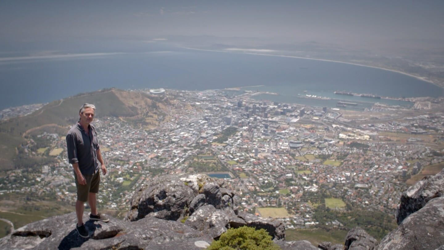 "Life-Sized City" host Mikael Colville-Andersen stands at the edge of a cliff overlooking Cape Town, South Africa. | "Life-Sized City: Cape Town"