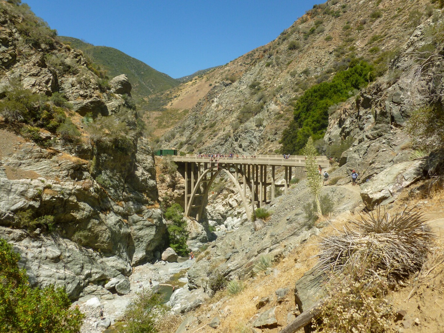 The abandoned bridge at the end of the Bridge to Nowhere hike in the San Gabriels' Sheep Mountain Wilderness Area. The bridge is a jumping point for bungee jumpers while a refreshing creek is available for hikers to cool off below.