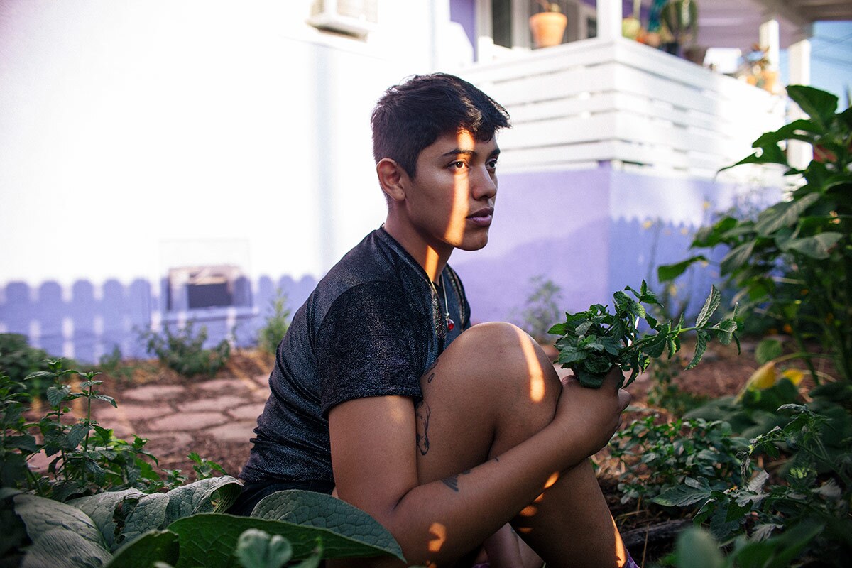 Loba harvests herbs in the garden of their East Hollywood home. | Samanta Helou Hernandez