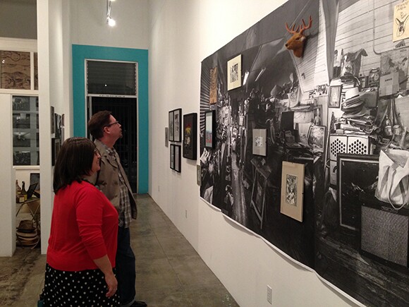 On lookers at "The Mind Of Joe Baiza: Paintings, Drawings, Photographs & Artifacts" at Cornelius Projects, San Pedro, CA, 2013<br /> Photograph by Laurie Steelink<br />