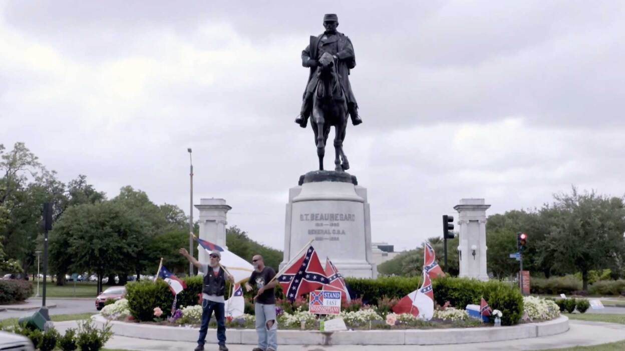 Protestors holding confederate flags in front of the General Beauregard Equestrian Statue, honoring P. G. T. Beauregard, in New Orleans, Louisiana. | Reel South