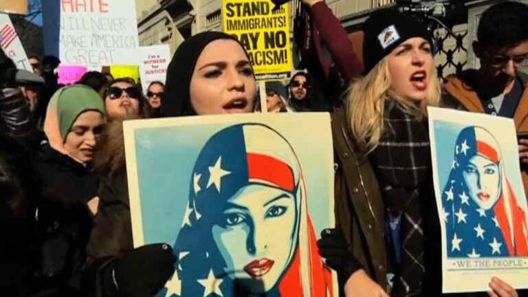 Women protesting Trump's travel ban. | Democracy Now