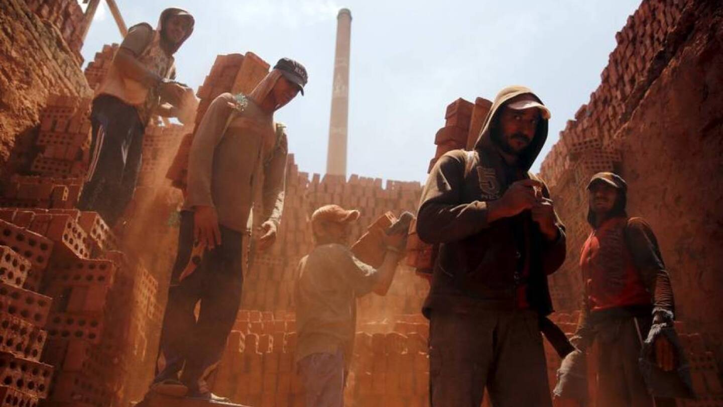 Laborers work at a traditional bricks factory in Arab Mesad district of Helwan, northeast of Cairo, May 14, 2015.