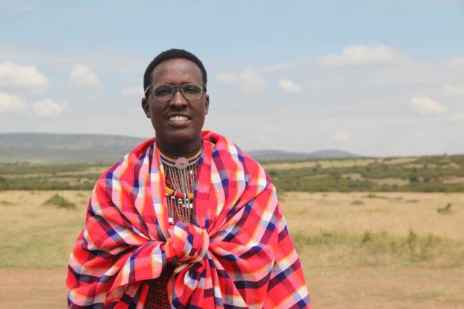 Nelson Ole Reiyia, founder of the Nashulai Maasai Conservancy, poses for a picture at the conservancy located near the Maasai Mara National Reserve in Narok county, Kenya on July 14, 2020. | THOMSON REUTERS FOUNDATION/Nita Bhalla