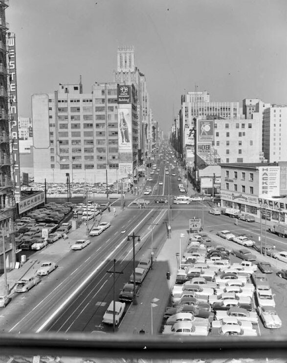A later view of the intersection of Broadway and Olympic, showing the surface parking lot that would eventually claim Broadway Place. Courtesy of the Metro Transportation Library and Archive. Used under a Creative Commons license.